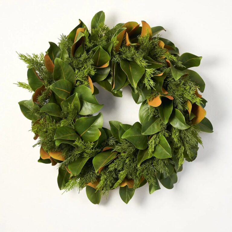 Close-up of blooms and berries on this Real Touch Magnolia Leaf Front Door Wreath