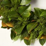 Alternate angle of the Real Touch Magnolia Leaf Front Door Wreath showing wreath face texture