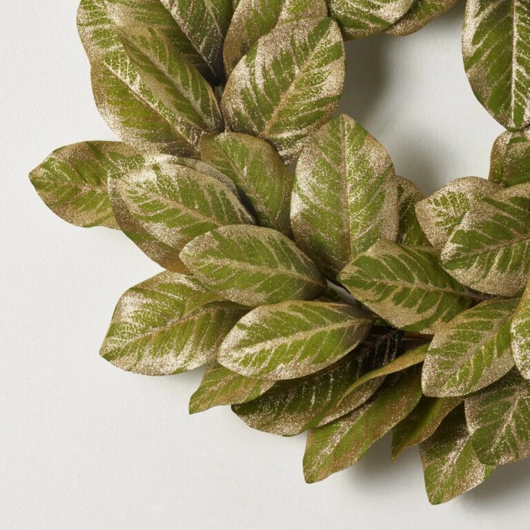 Close-up of blooms and berries on this Green and Gold Metallic Magnolia Door Holiday Wreath