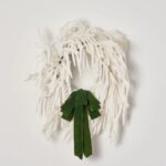 Side view of the Norfolk Collection - Real Touch Holiday Winter Wreath revealing frame and