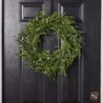 Alternate angle of the Seeding Winter Juniper Berry Greenery Front Door Wreath showing wreath face