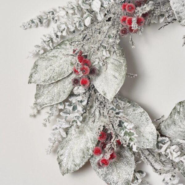 Close-up of blooms and berries on this Snow Covered Magnolia Leaf Holiday Winter Wreath