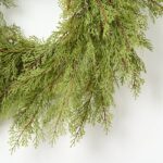 Close-up of blooms and berries on this Real Touch Cedar Front Door Holiday Winter Wreath