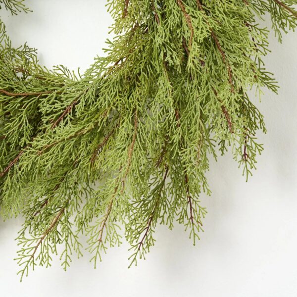 Close-up of blooms and berries on this Real Touch Cedar Front Door Holiday Winter Wreath