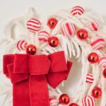Alternate angle of the Real Touch White Norfolk Pine, Door Mantle Wreath showing wreath face
