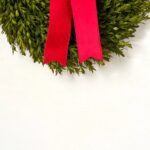 Side view of the Realistic English Boxwood Leaf Christmas 5 Holiday Bow revealing frame and