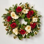 Alternate angle of the Magnolia Majesty Front Door Christmas Door Christmas Wreath showing wreath face