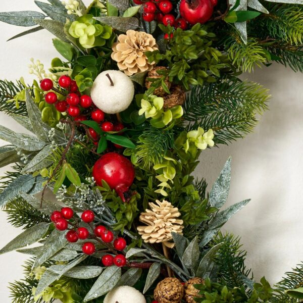 Close-up of blooms and berries on this Home for the Holidays Door Christmas Wreath