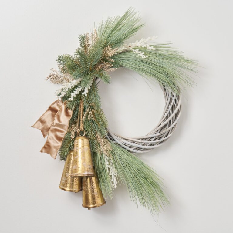 Close-up of blooms and berries on this Merry Bells Keep Ringing Front Door Christmas Wreath
