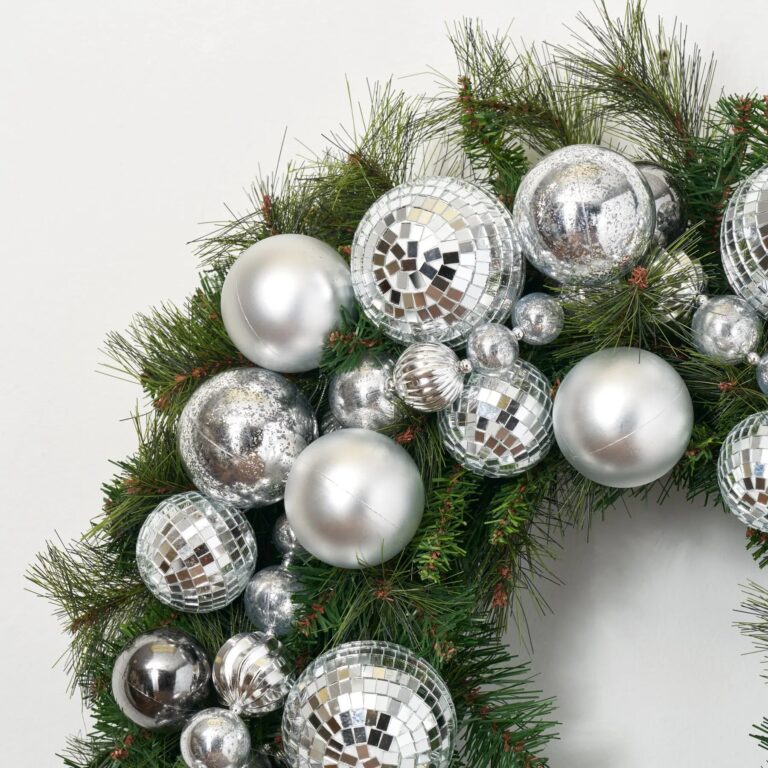 Close-up of blooms and berries on this Disco Christmas - Mirrored Ball Door Holiday Wreath