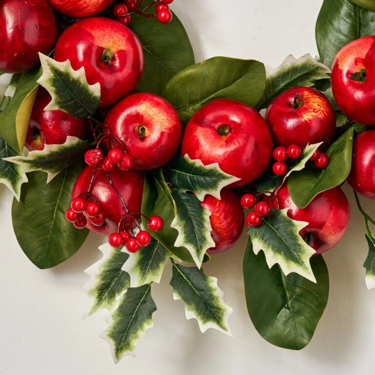 Close-up of blooms and berries on this Winter Candy Apple - Red Door Christmas Wreath