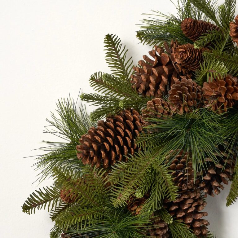 Close-up of blooms and berries on this Classic Mixed Pine with Pinecones Door Christmas Wreath