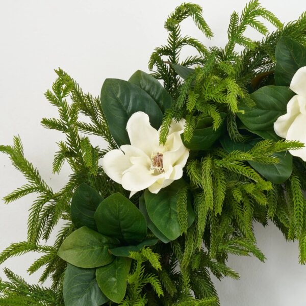 Close-up of blooms and berries on this Grand Lux - White Magnolia Front Door Wreath