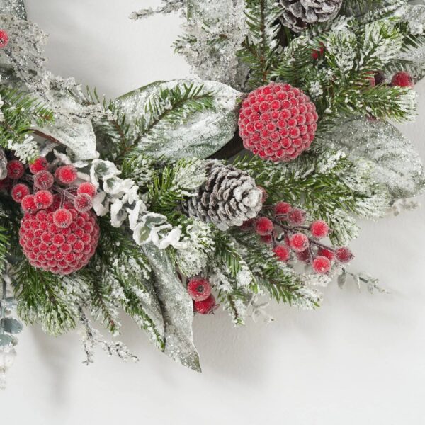 Close-up of blooms and berries on this Holiday Frost - Snow Covered Door Christmas Wreath