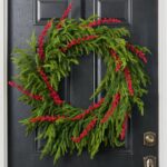 Close-up detail capturing ribbon and accent detail of the Berry Christmas to All Front Door