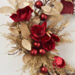 Alternate angle of the Wine Magnolia and Gold Cedar Velvet Ribbon showing wreath face texture