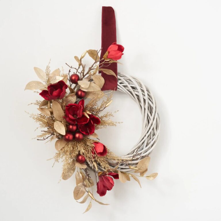 Close-up of blooms and berries on this Wine Magnolia and Gold Cedar Velvet Ribbon