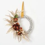 Alternate angle of the Bronzed Copper Poppy and Magnolia Velvet Ribbon showing wreath face texture
