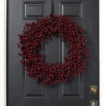 Alternate angle of the Waterproof Deep Burgundy Red Berry Front Door Wreath showing wreath face