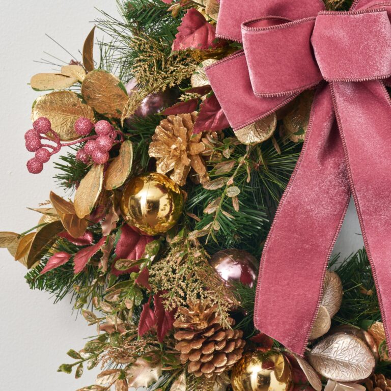 Close-up of blooms and berries on this Merry Mauve Noel - Gold Front Door Wreath