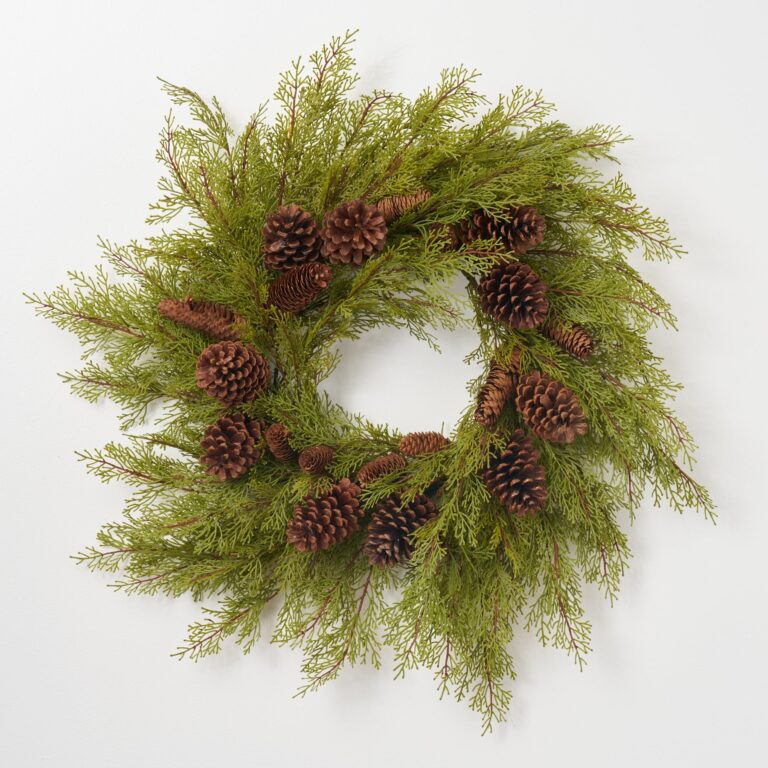 Close-up of blooms and berries on this Lifelike Winter Cedar Greenery Door Holiday Wreath