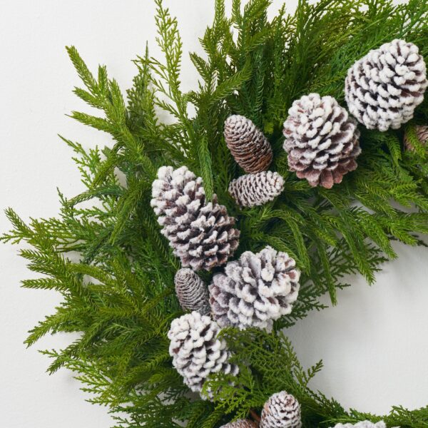 Close-up of blooms and berries on this Deluxe Cypress and Norfolk Winter Door Holiday Wreath