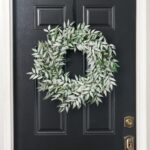 Alternate angle of the Frosted Nandina Winter Greenery Faux Front Door Wreath showing wreath face