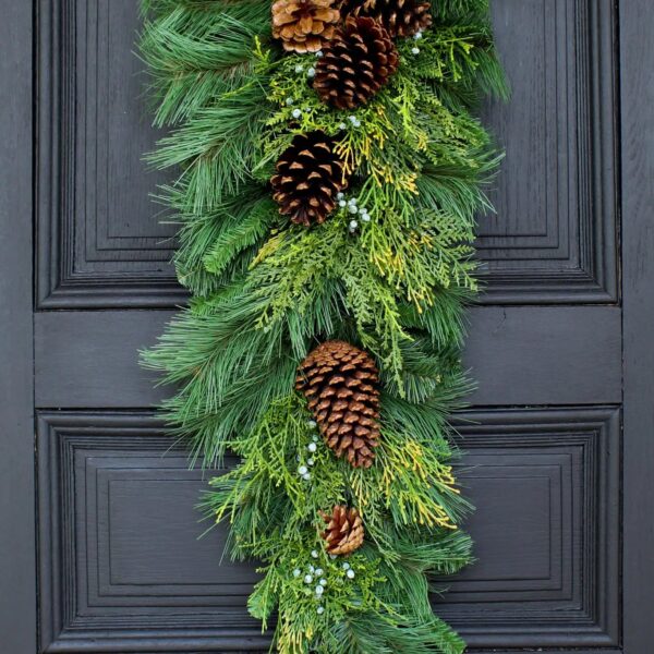 Close-up of swag tail detail on this Classic Holiday Greens and Pinecone Door Winter Swag