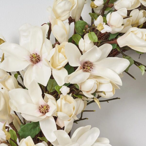 Close-up of blooms and berries on this Classic Real Touch Blooming White Large Door Wreath