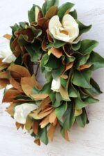The Classic Real Touch White Magnolia Front Door Wreath shown in full, highlighting full wreath