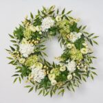 The Cream and Green Hydrangea, Ranunculus, Front Door Wreath shown in full, highlighting full wreath