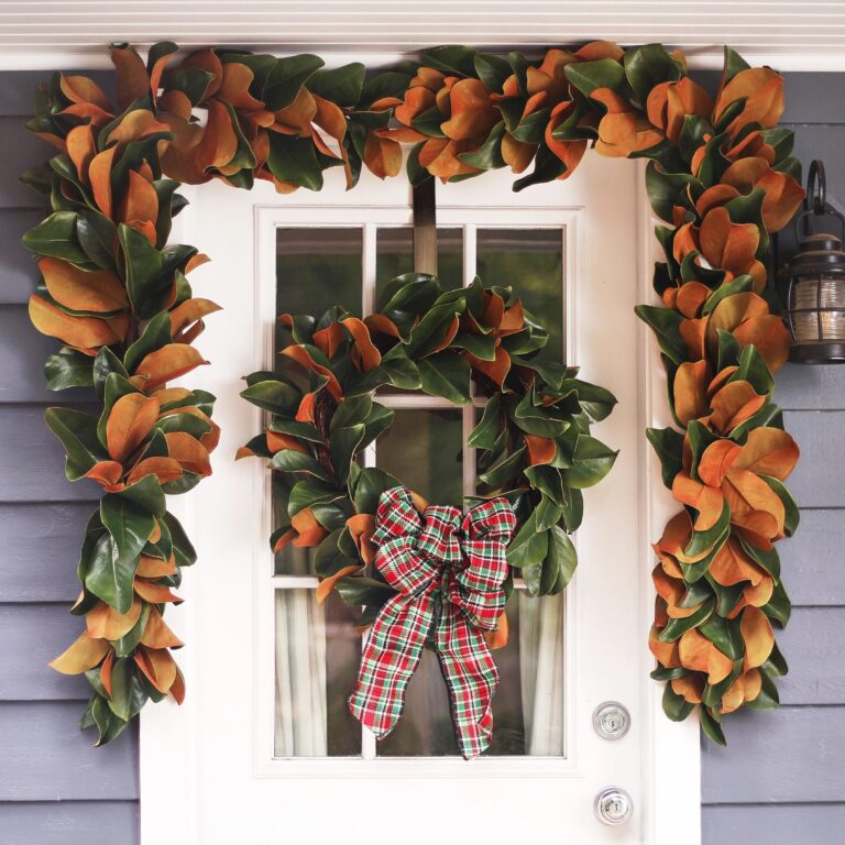 Close-up of blooms and berries on this Classic Real Touch Magnolia Leaf Everyday Greenery Wreath
