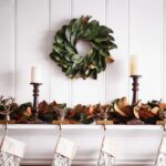 Close-up of blooms and berries on this Real Touch Magnolia Leaf Mini Candle Wreath Centerpiece