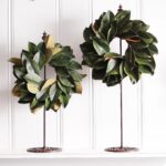 The Real Touch Magnolia Leaf Mini Candle Wreath Centerpiece shown in full, highlighting full wreath