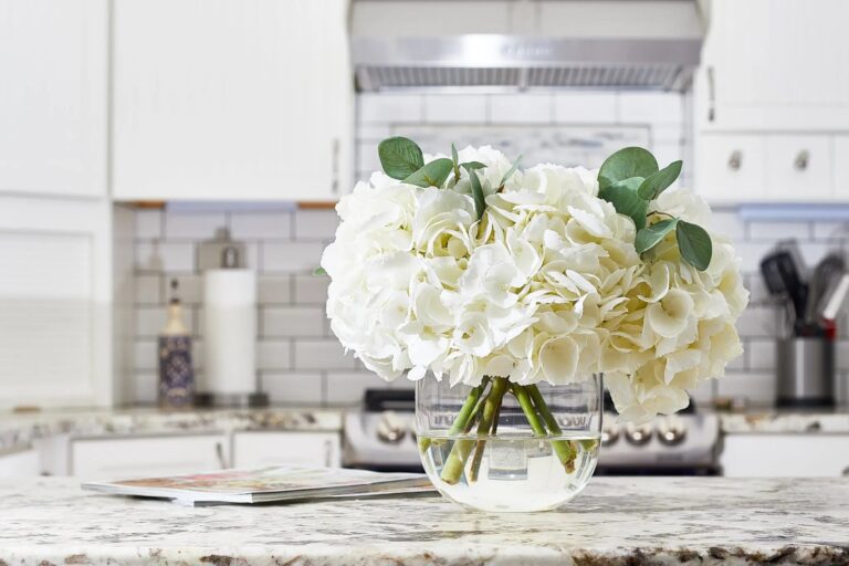 Close-up of vase silhouette detail on this Large White Hydrangea and Eucalyptus Rounded Glass Vase