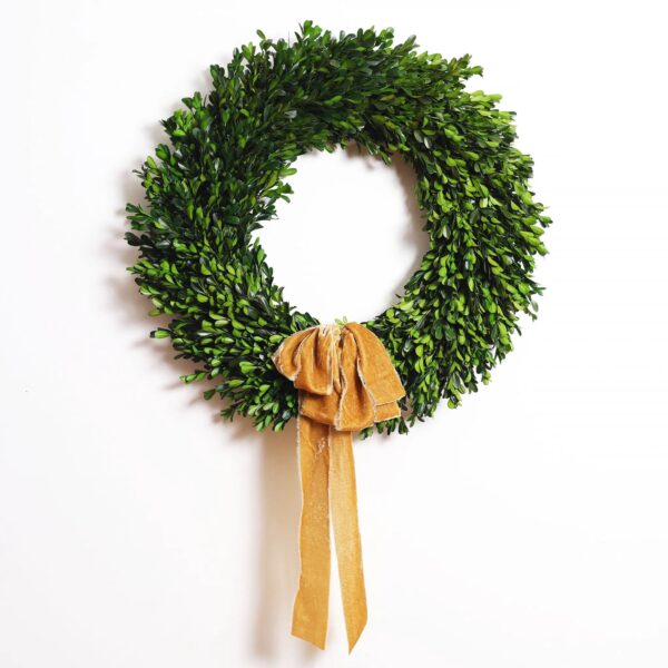 Close-up of blooms and berries on this Natural Preserved Green Boxwood Wreath with Velvet Ribbon