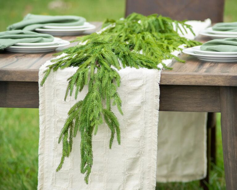 Close-up of greenery along the garland on this Norfolk Collection - Real Touch Front Door