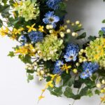 Close-up of blooms and berries on this Green Hydrangea, Forsythia, Blue Cosmos Berry Spring Wreath
