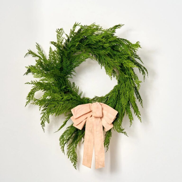 Close-up of blooms and berries on this Blush Pink Velvet Lux Hand Drape Loop Bow