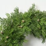 Close-up of blooms and berries on this Real Touch Seeding Juniper Berry Front Door Wreath