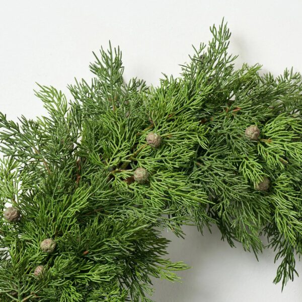 Close-up of blooms and berries on this Real Touch Seeding Juniper Berry Front Door Wreath