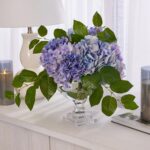 Alternate angle of the Lifelike Blue Violet Mixed Large Water Illusion Arrangement showing bloom arrangement