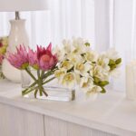 Alternate angle of the Tranquil Elegance - White Real Water Illusion Arrangement showing bloom arrangement