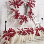 Detail view of layered greenery detail from the Iced Red Berry and Real Door Mantle