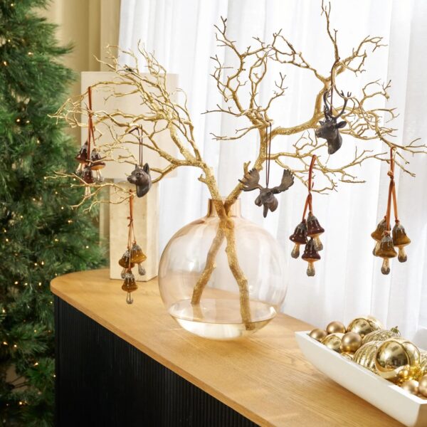 Close-up of vase silhouette detail on this Faux Gold Sparkle Manzanita Branches Water Illusion Arrangement