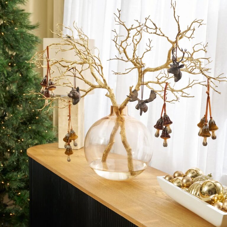Close-up of vase silhouette detail on this Faux Gold Sparkle Manzanita Branches Water Illusion Arrangement
