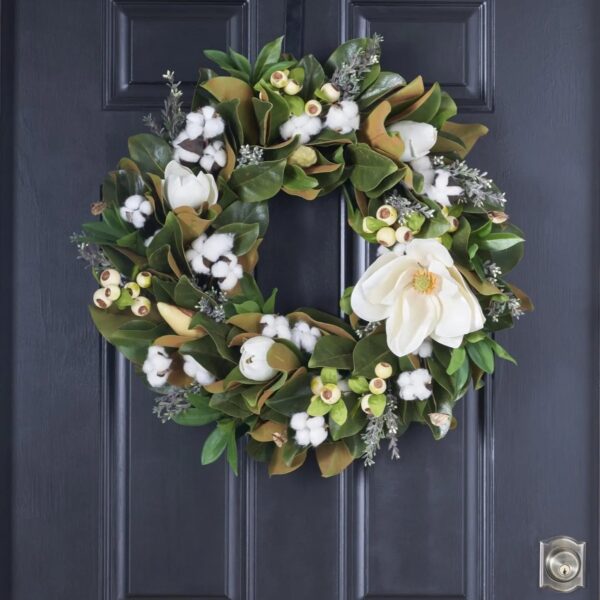 Close-up of blooms and berries on this Blooming Magnolia, Cotton and Cream Seasons Estate Wreath