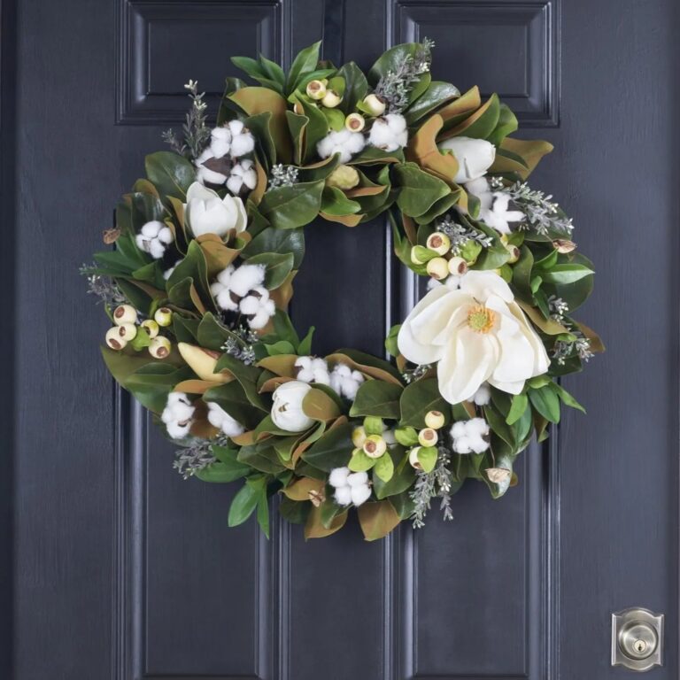 Close-up of blooms and berries on this Blooming Magnolia, Cotton and Cream Seasons Estate Wreath