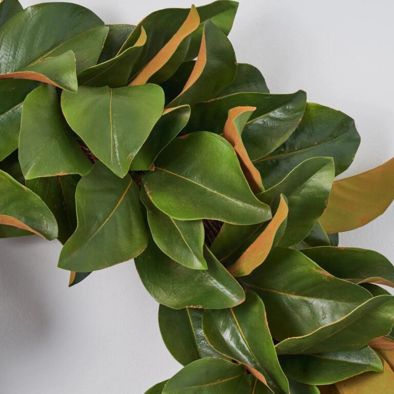 Close-up of blooms and berries on this Classic Real Touch Magnolia Leaf Wreath