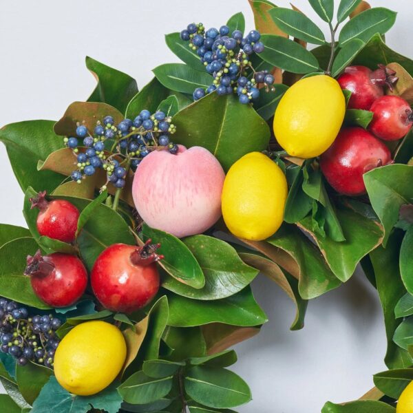 Close-up of blooms and berries on this Real Touch Magnolia Fruit Wreath Front Door Wreath